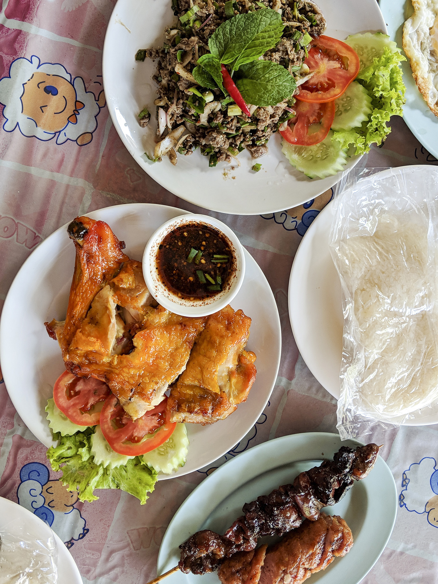 Spicy minced beef salad, grilled chicken, Thai sausage and skewer of chicken hearts + livers at A La Carte