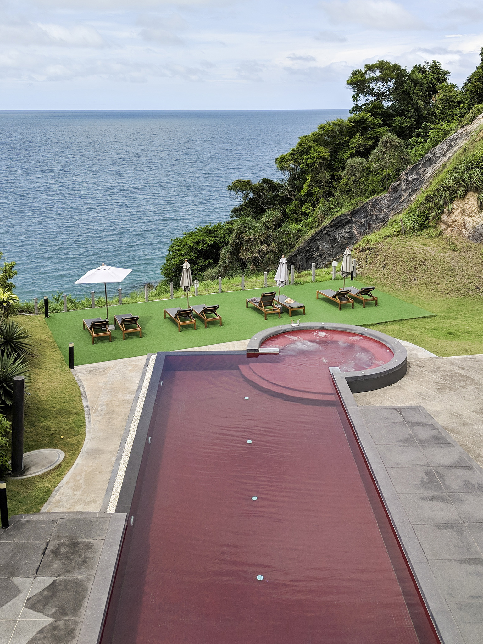 the striking red pool at the Houben Hotel