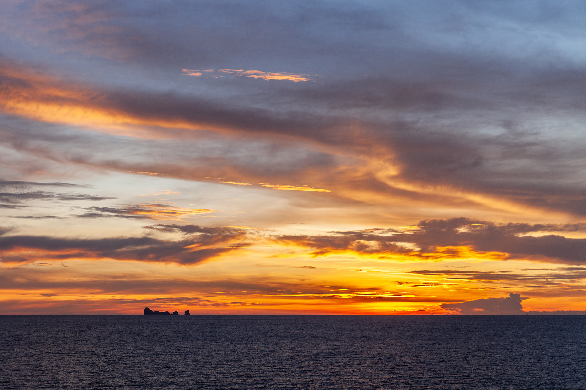 Sunset with the Phi Phi Islands on the horizon