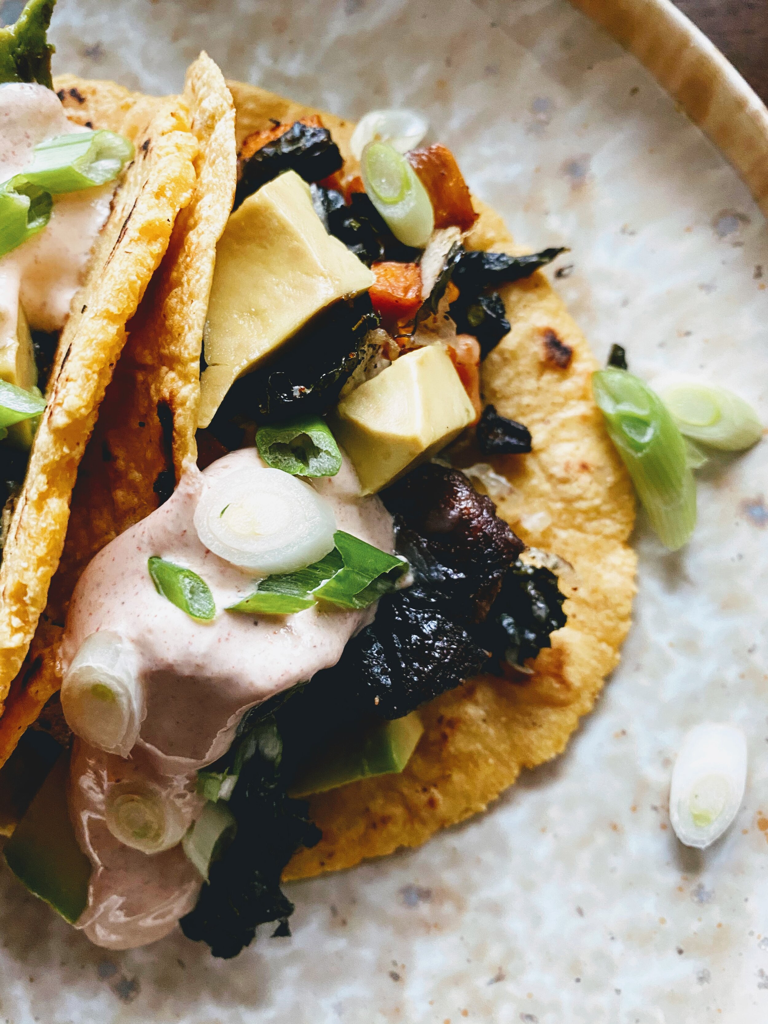 Sheet Pan Cheesy Sweet Potato, Mushroom, and Kale Tacos up close.jpg