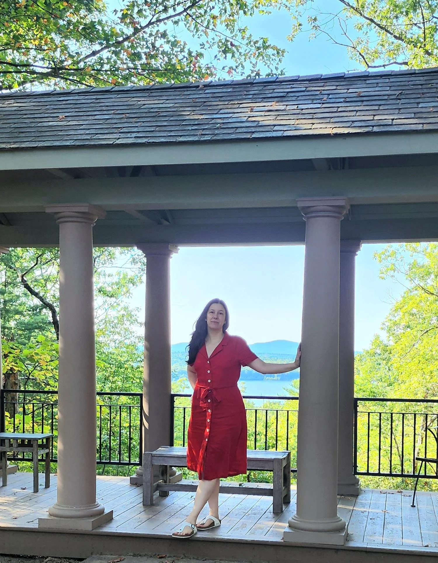Kara of Wellness Blessing is wearing a red linen dress by Quince