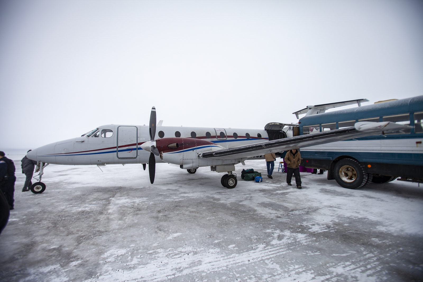 A small bus meets planes at the airstrip in Kaktovik