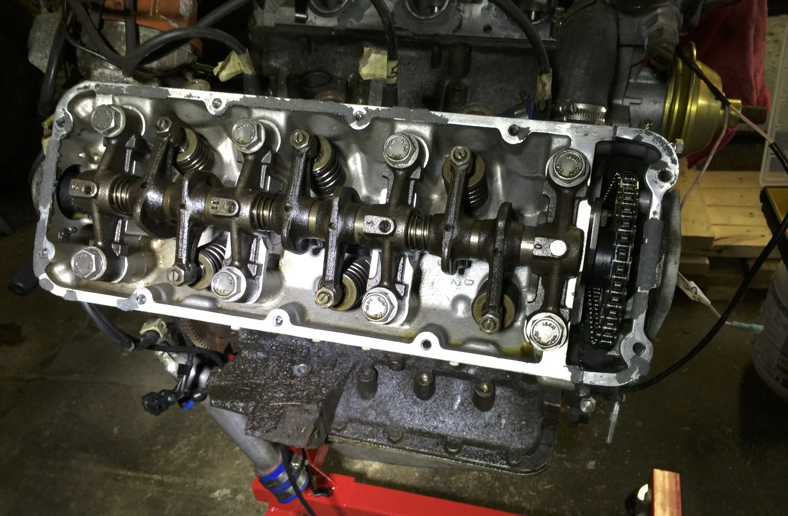 Passenger timing cover removed, showing the valve train, cams and the top of the timing chain.