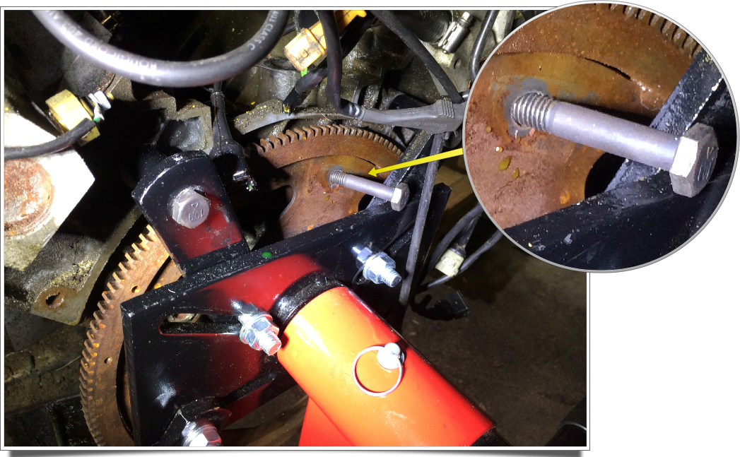 Bolt inserted in the flex plate to keep the engine from turning while removing the main pulley. The bolt wedged against the engine; I had intended to wedge it against the stand, but this worked just as well.