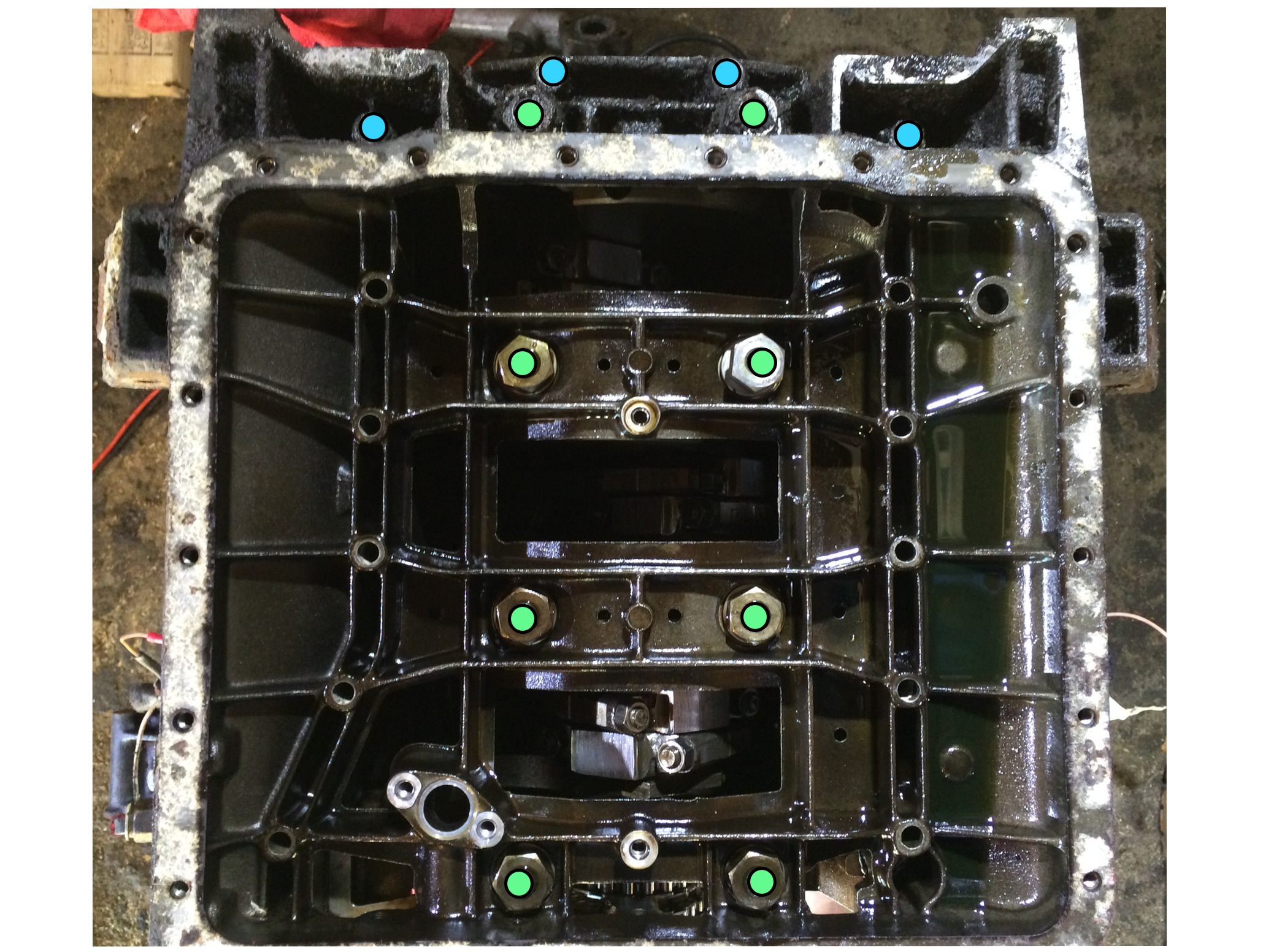 The eight (8) large nuts (green) are removed with a 22mm socket, while the four (4) smaller bolts (blue) are removed with an 11mm socket.