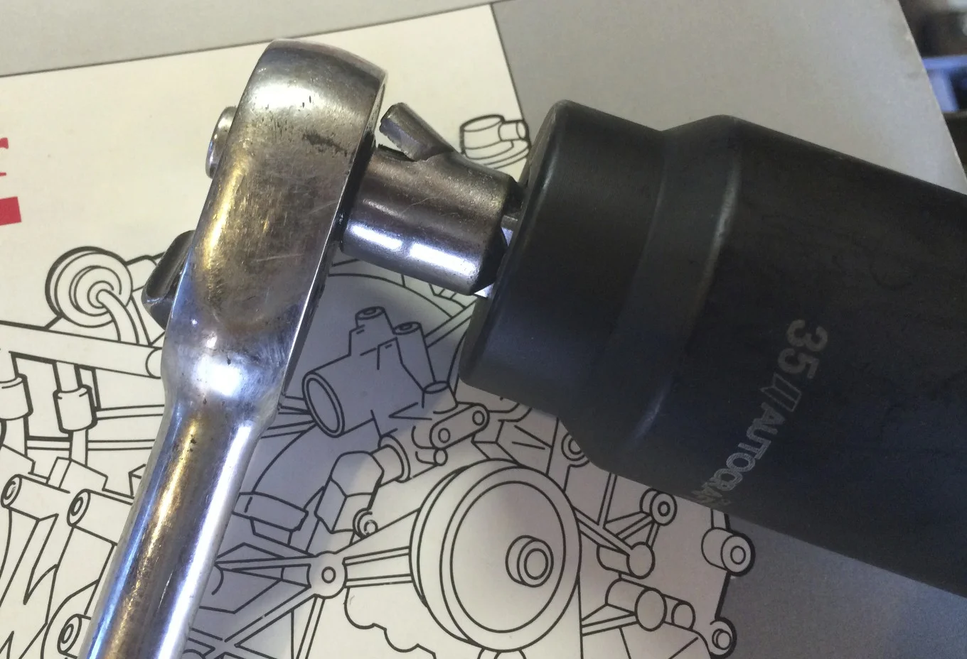 Broken 3/8" to 1/2" socket adaptor from trying to break the main pulley nut free.