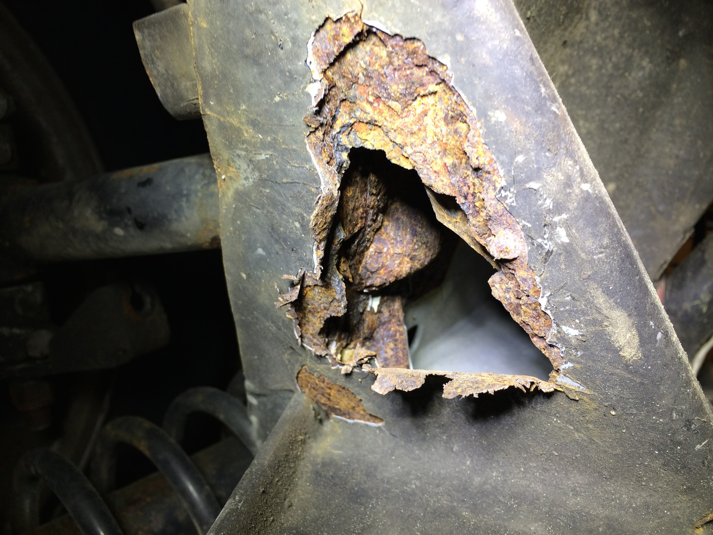 Looking into the hole reveals the inside is rusted, but tapping it revealed the metal is solid.
