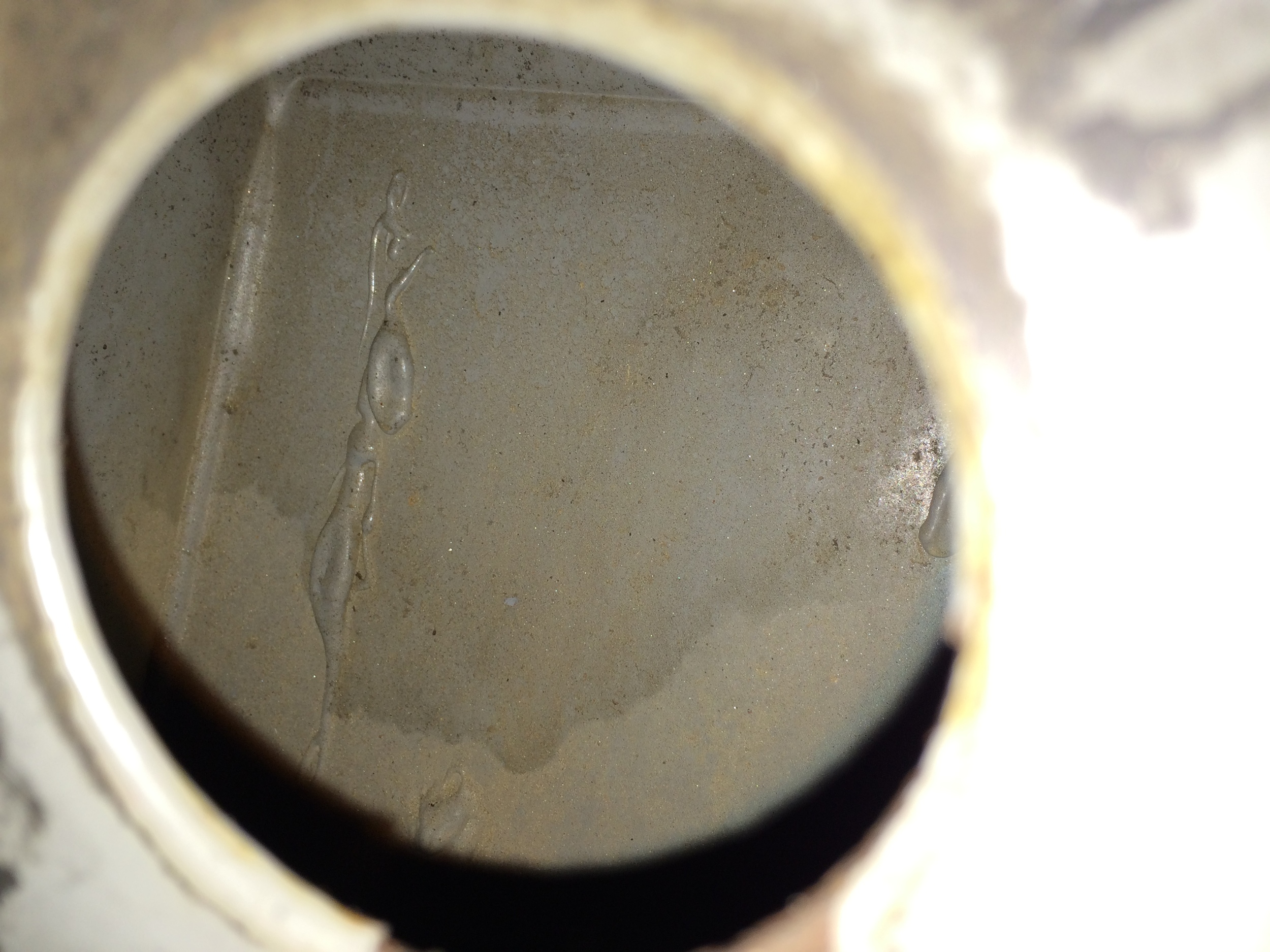 Looking through the hole int he frame showed no damage tot he epoxy, but reaching in allowed me to peel off sheets that had come loose from the opposite face.