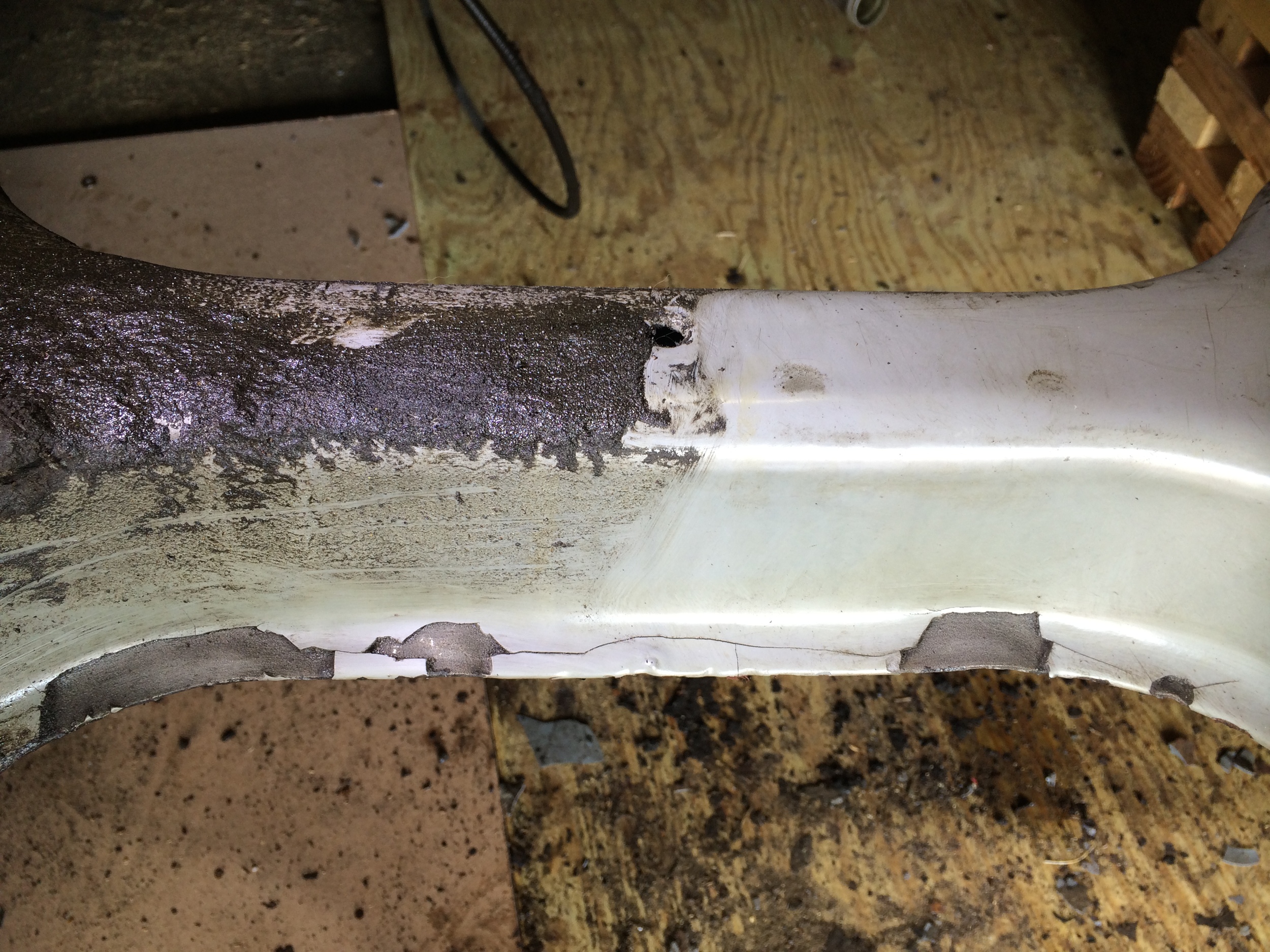 Closer view of the before-and-after engine cradle cleaning.