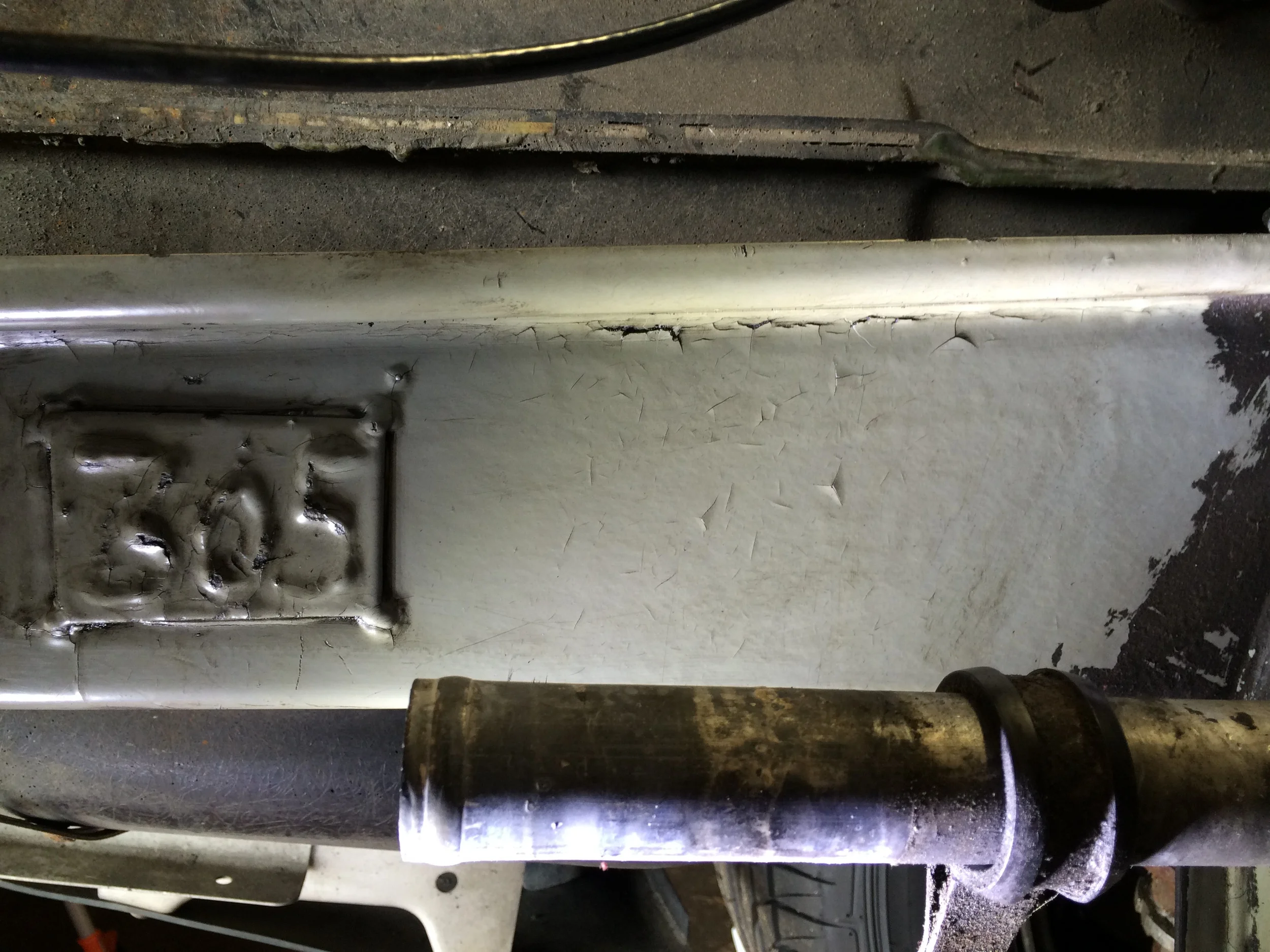 There was so much oil caked onto the frame that i didn't even know this 305 plate was there until I cleaned it off. The remaining black on the right is undercoating.