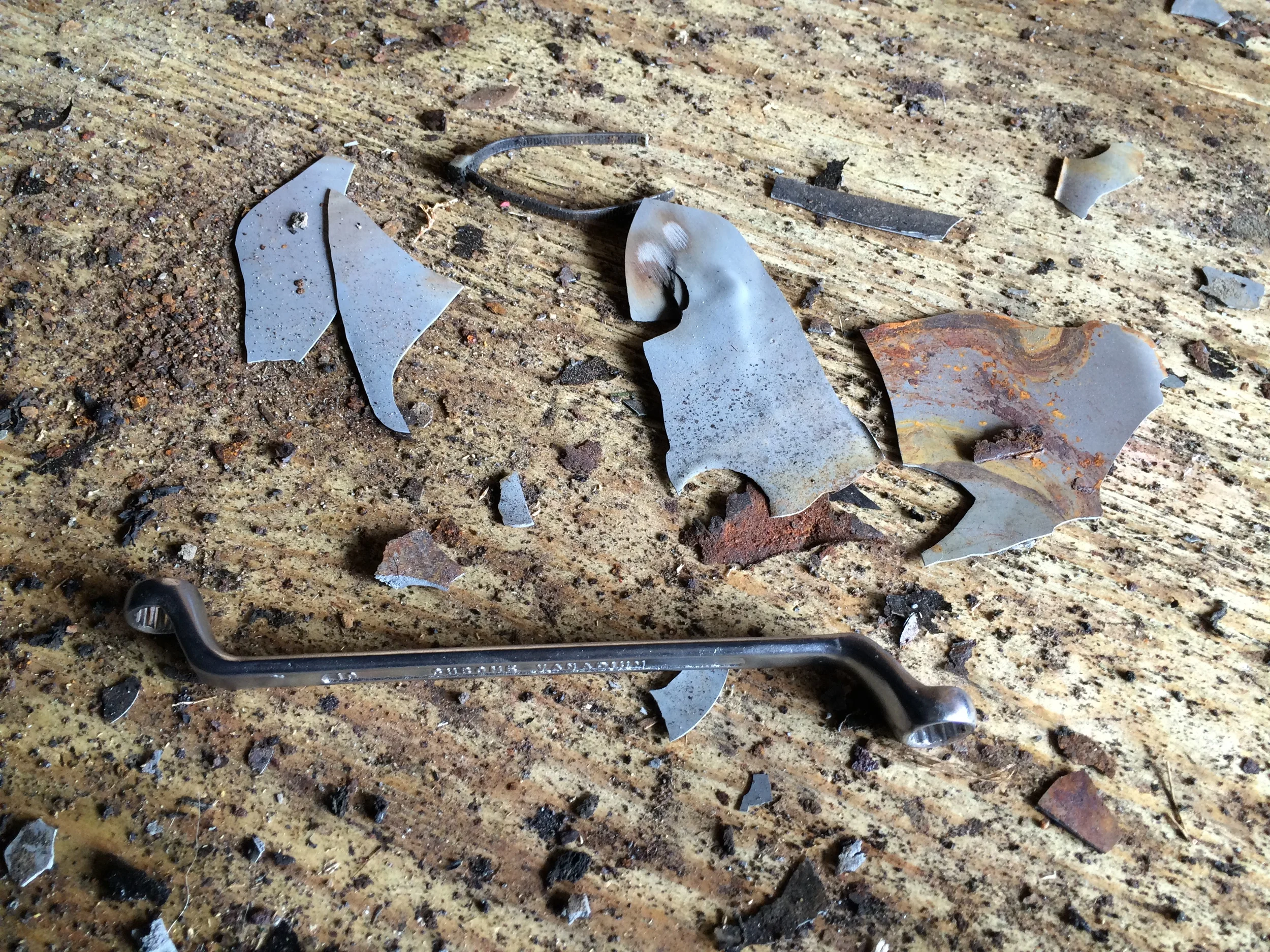 Sheets of epoxy that had separated from the frame and flaked off.