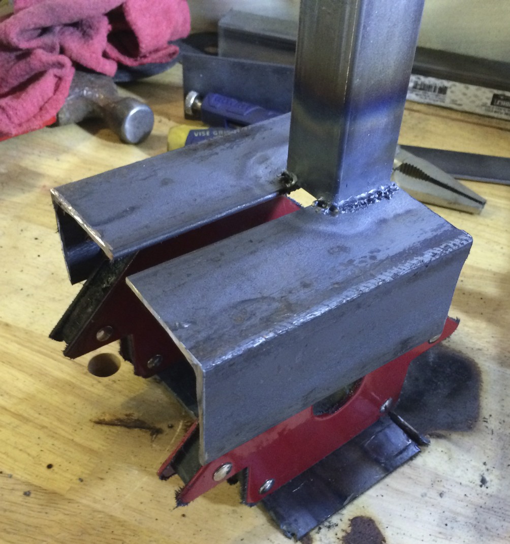 The spine welded to the cradle, using a frame of magnets to keep everything together during welding.