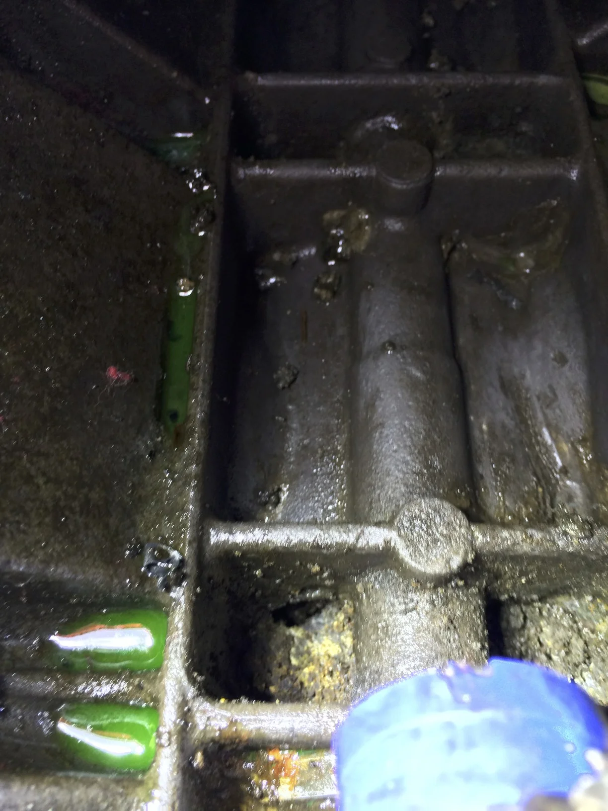 The hole in the block, from the outside, visible in the lower left of the image.