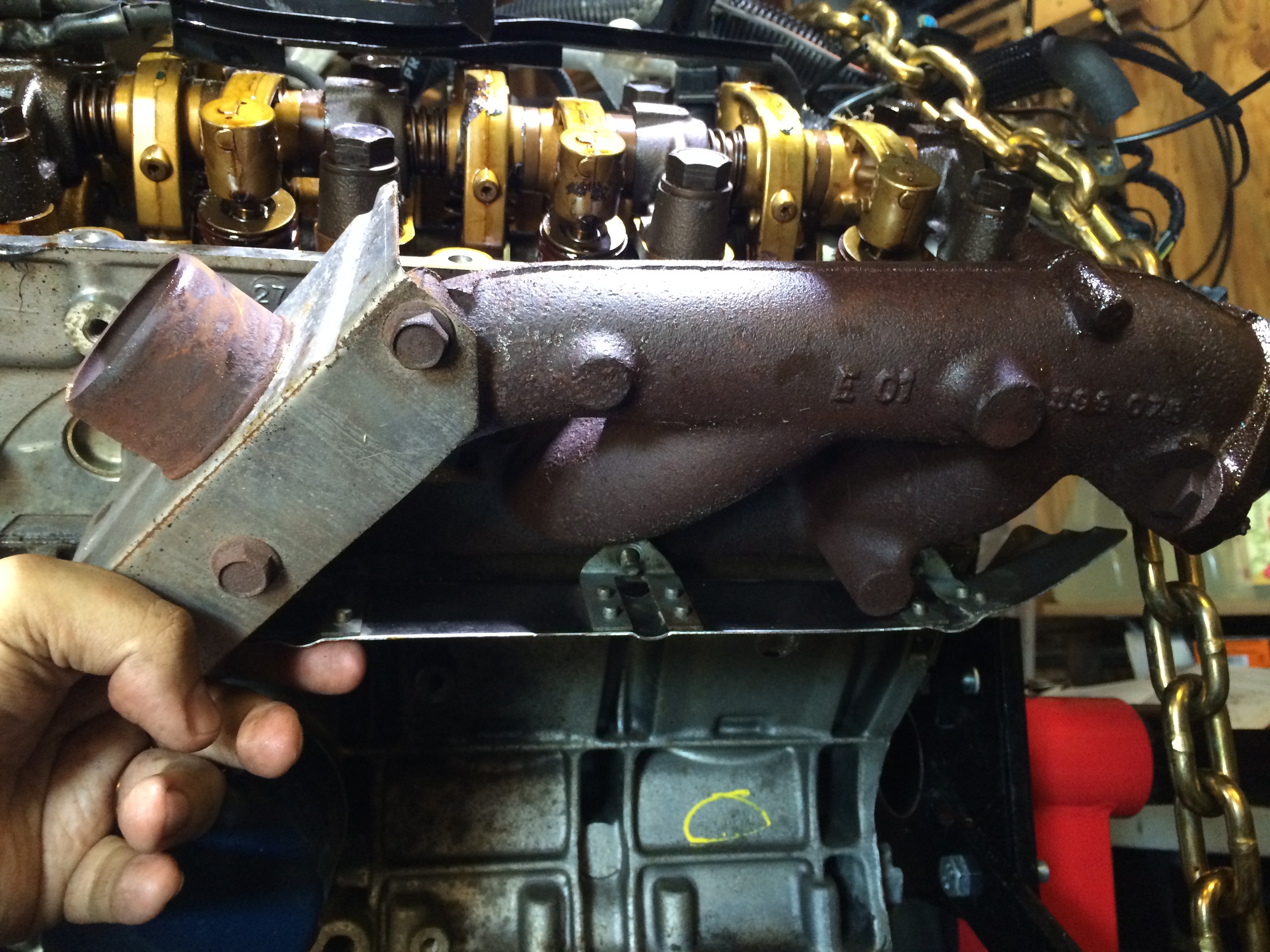 The heat shield under one of the manifolds is held on with an additional three nuts.