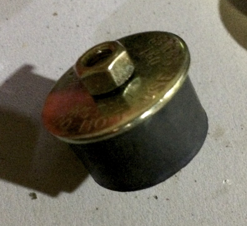 A rubber core plug that fits various size holes. After failing to find a perfectly fitting metal plug, I resorted to this.