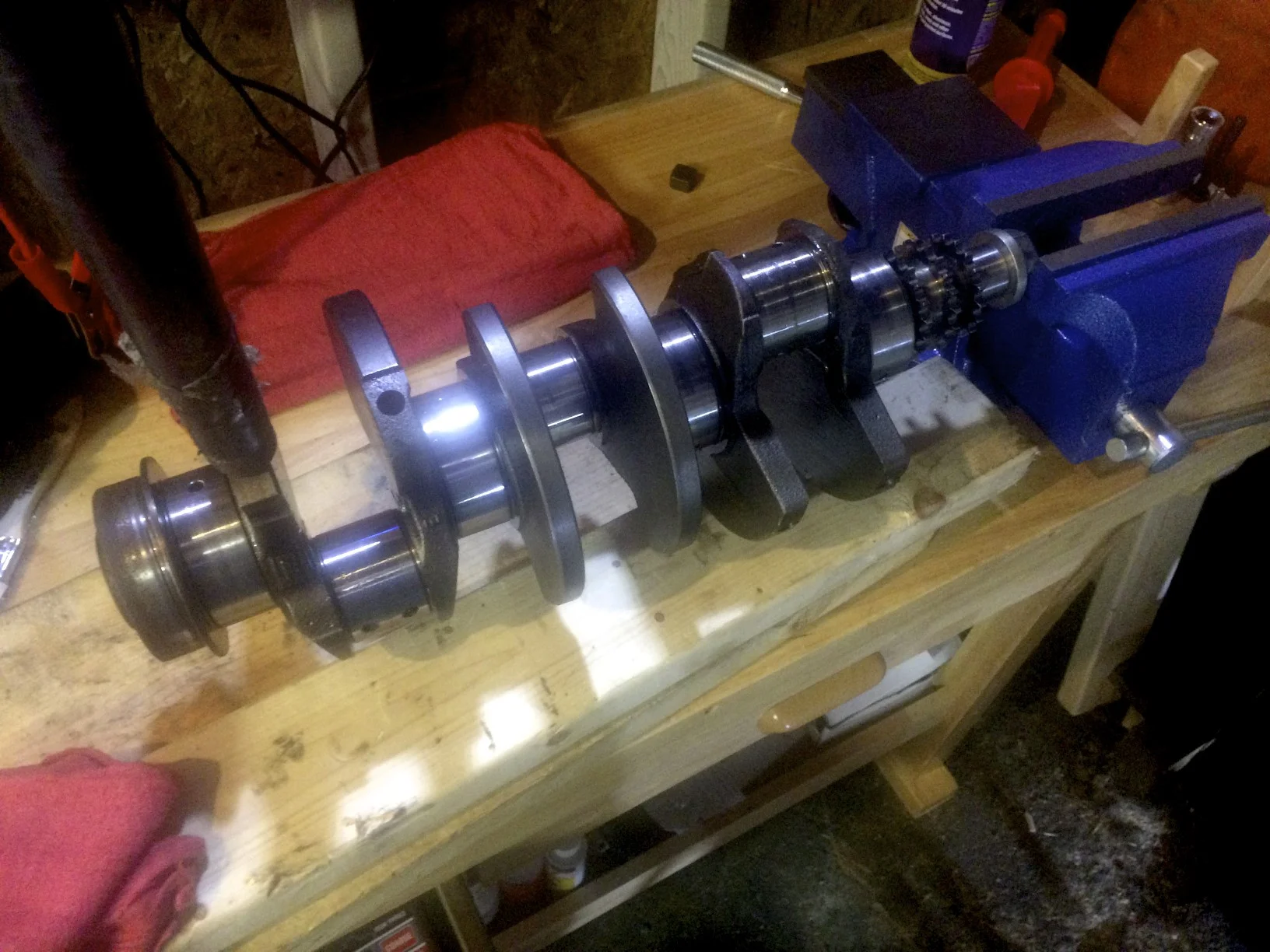 Using a vice, a socket on an extension, and a piece of pipe I was able to finally break the nut free from the crank.