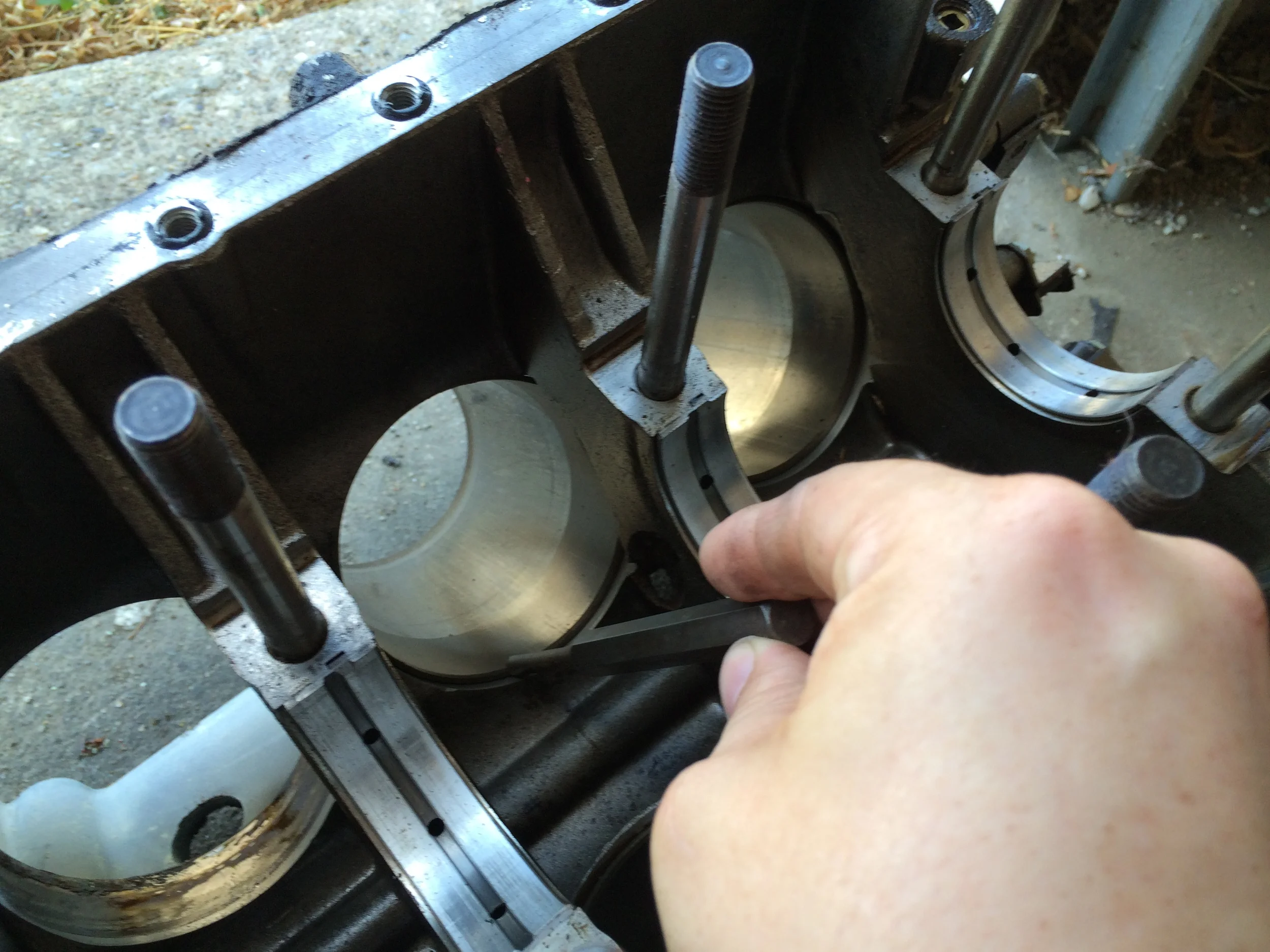 Placing a punch to tap out the liners.