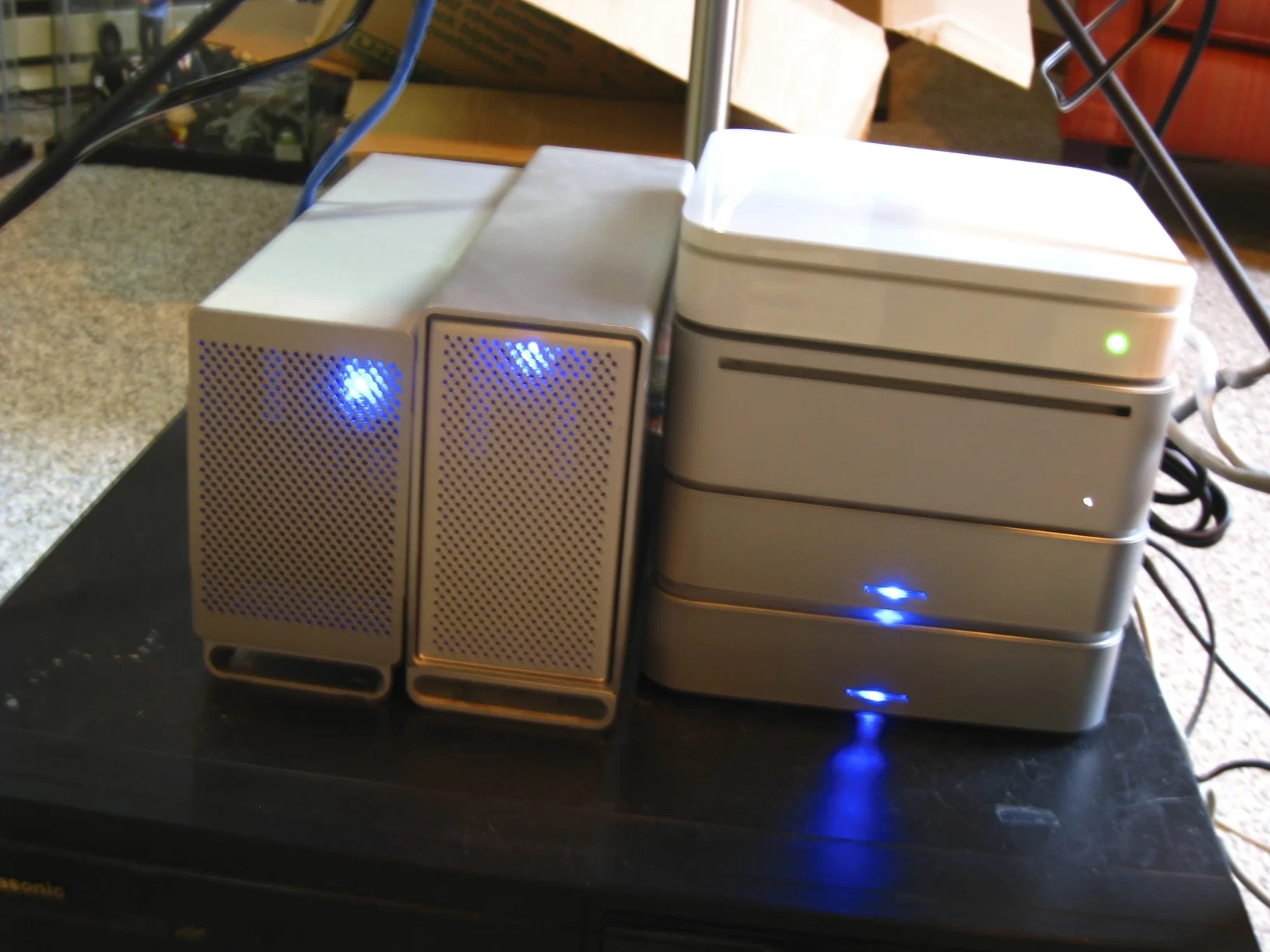 Mac mini, Airport Extreme and four hard drive enclosures configured as mirrored RAIDs