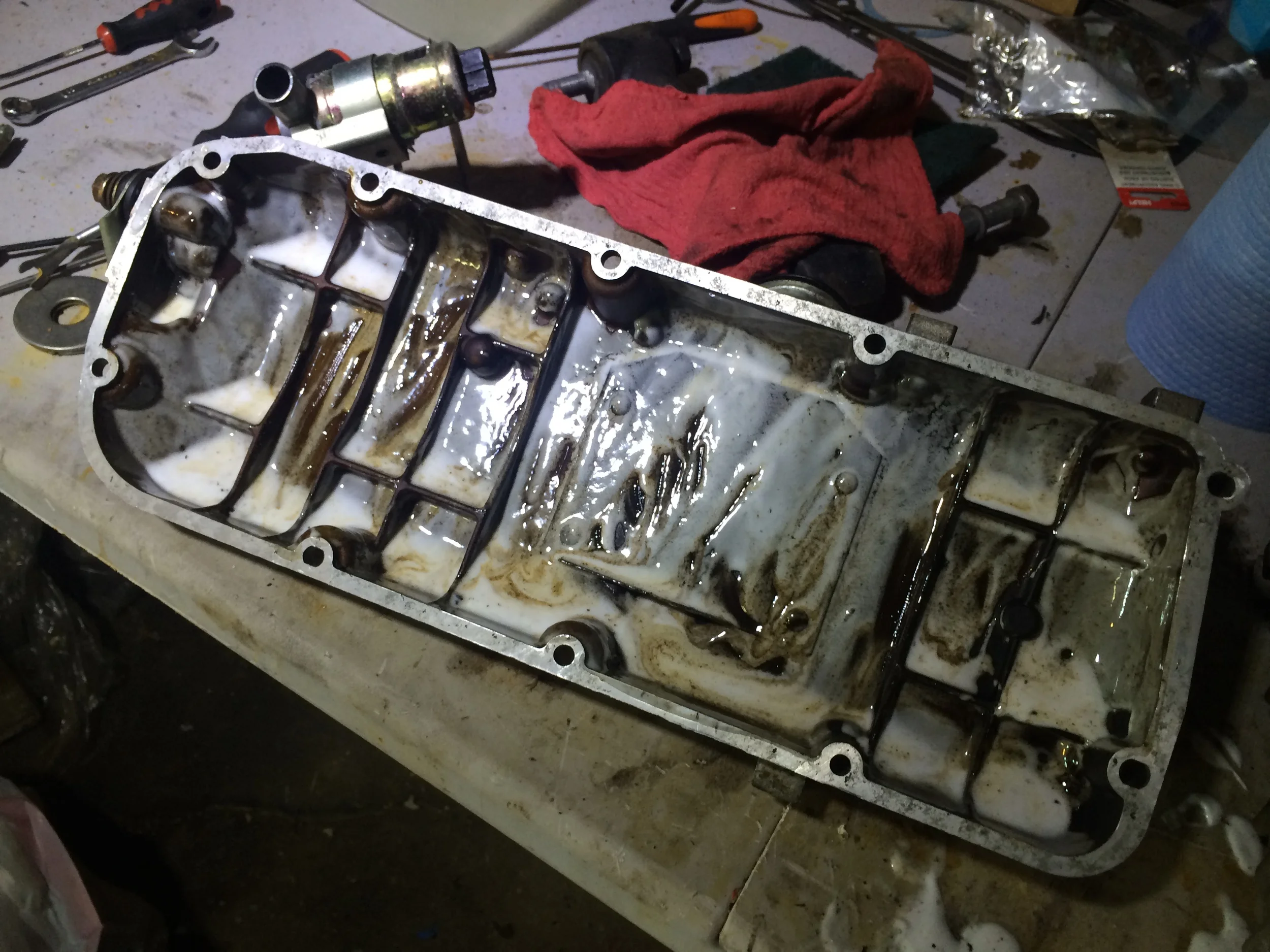 Permatex Gasket Remover applied to the inside of the valve cover to clean the oil residue away.