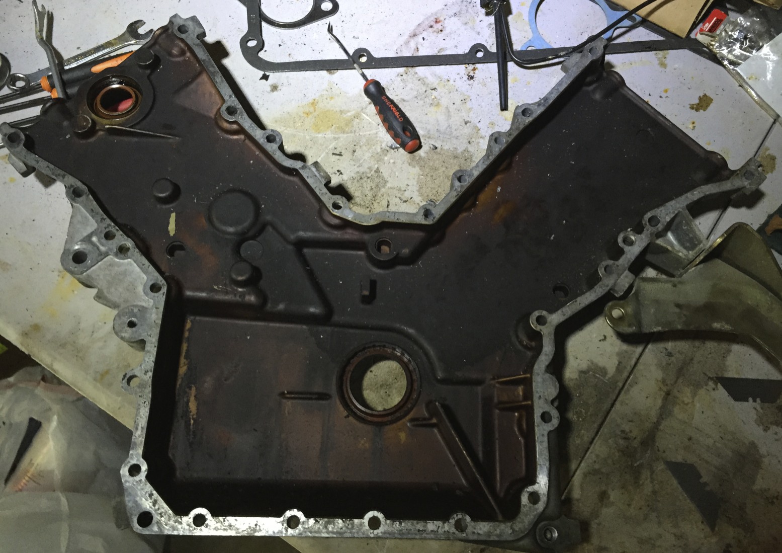 The timing cover after the gasket has been removed.
