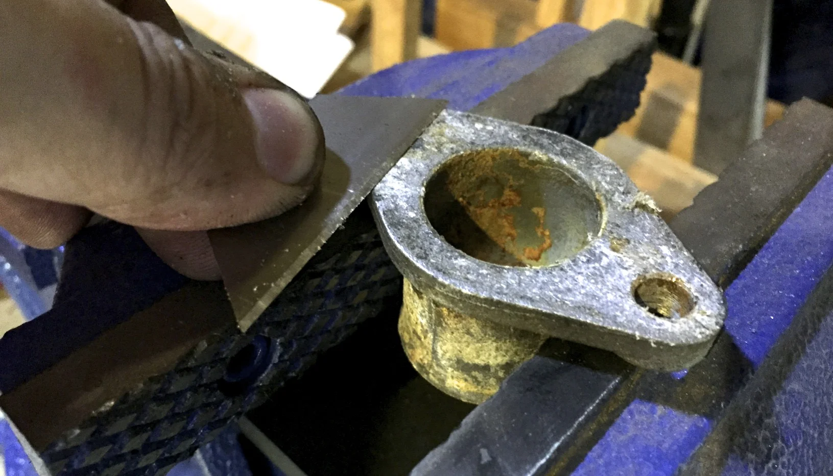 Removing gaskets from the coolant adaptors with a razor.