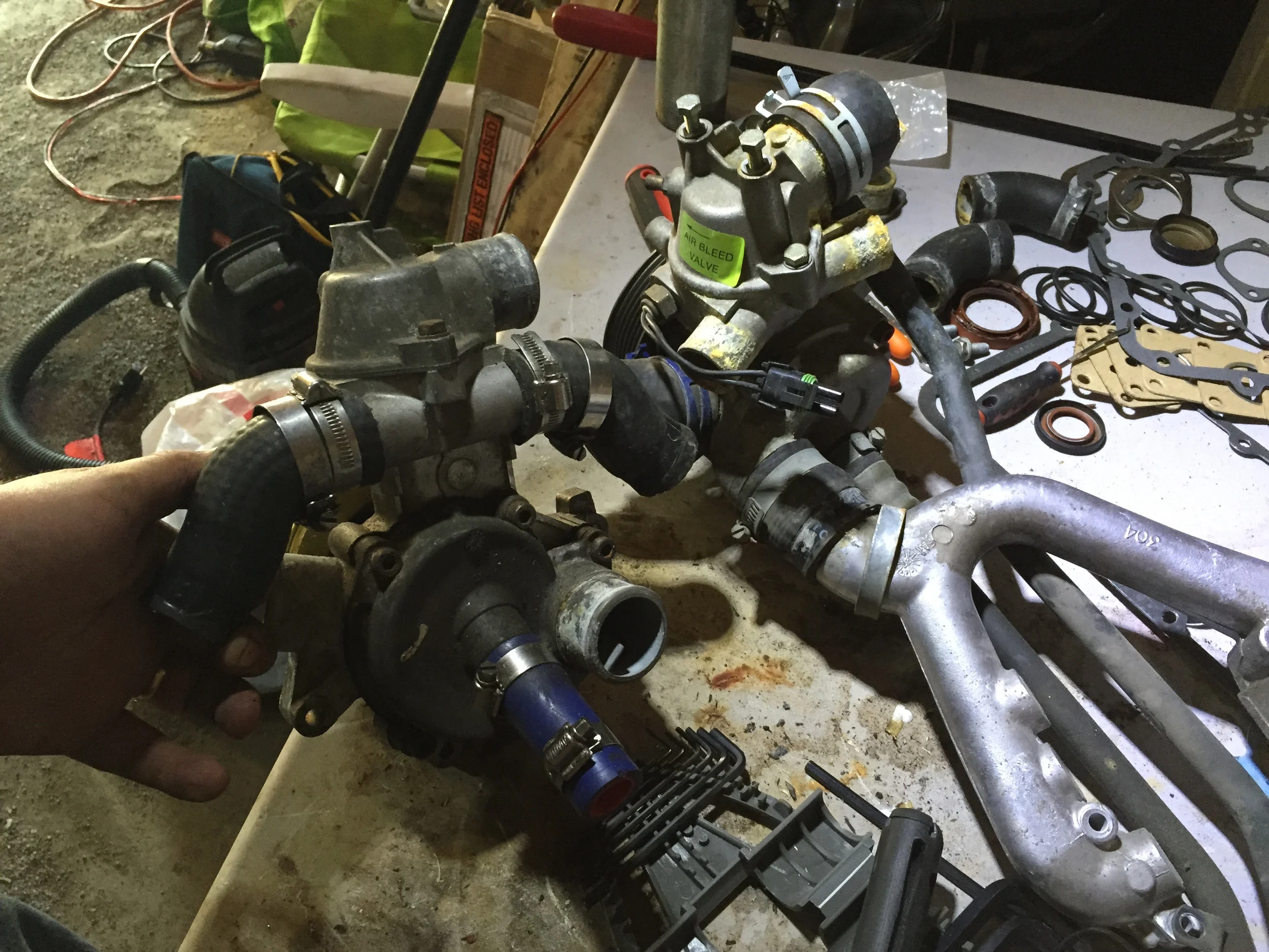 The back of the 2.8L (left) and 3.0L (right) pumps, with the Y pipe and coolant pipes still attached to the 3.0L one.