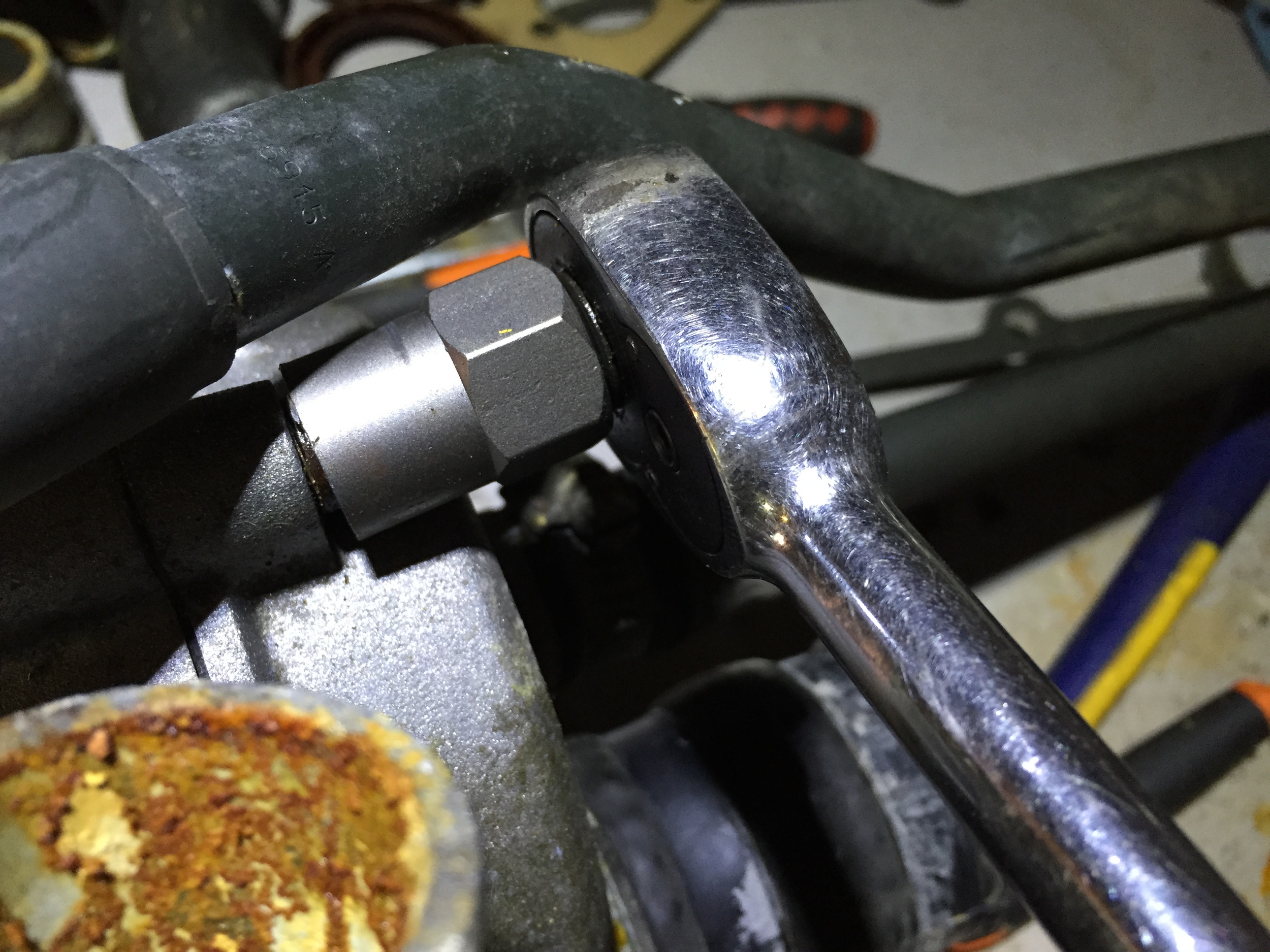 Using an Irwin Bolt-Grip on the end of a socket to remove a striped socket cap screw.