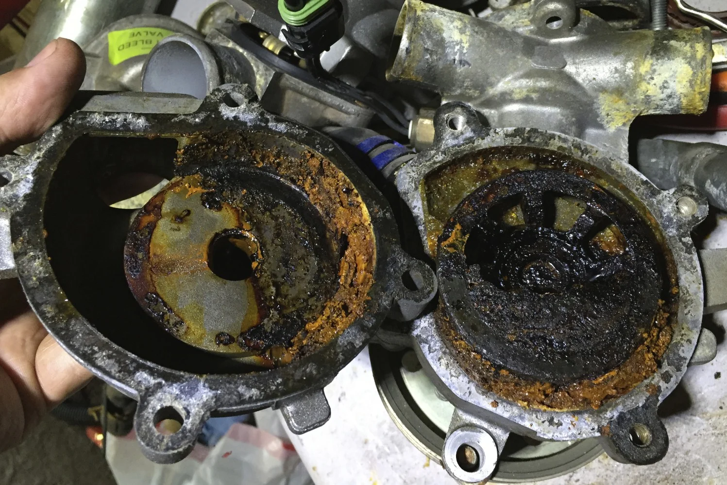 The messy internals of the old water pump.