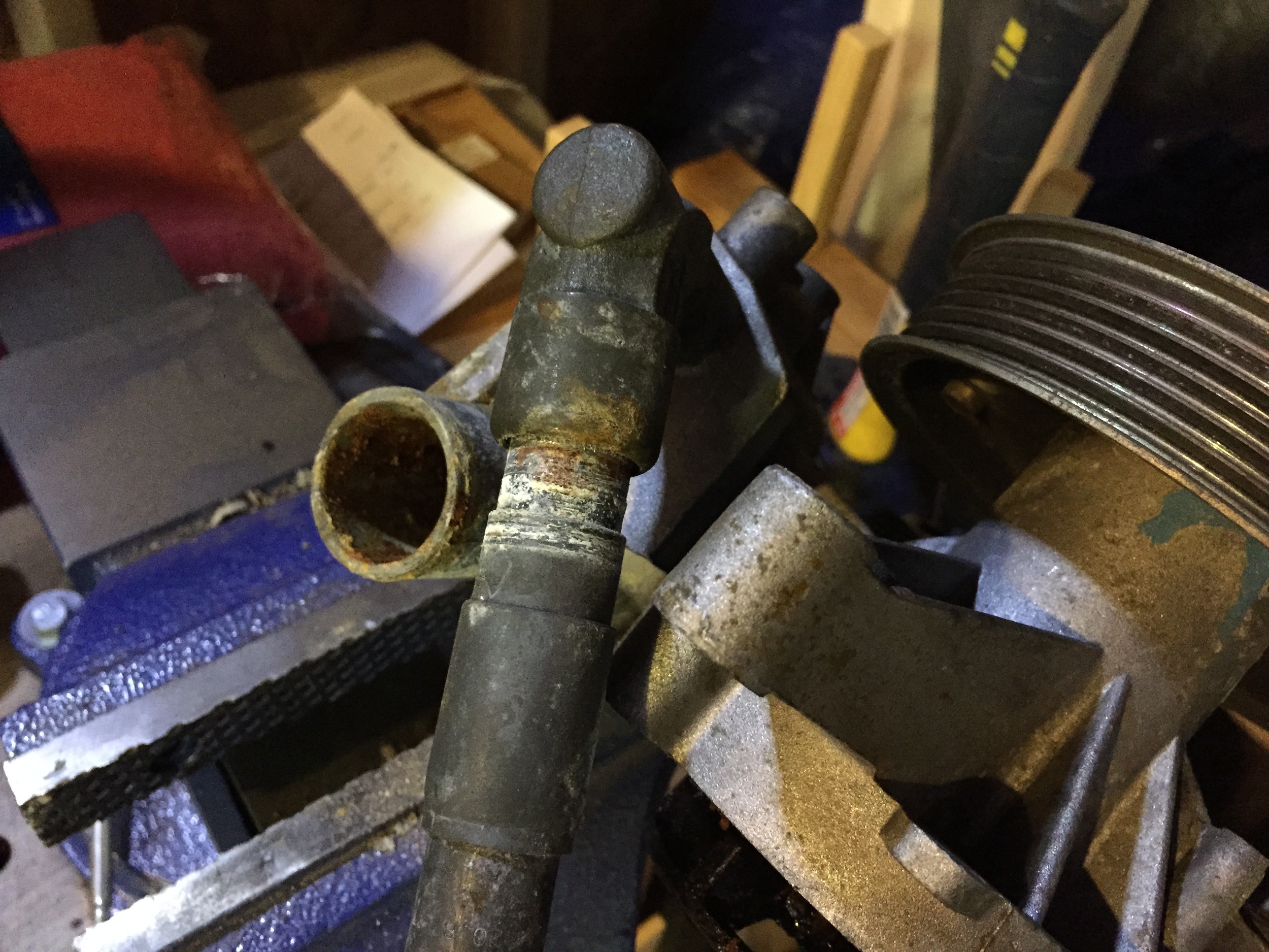 The pipe nearly removed from the elbow.