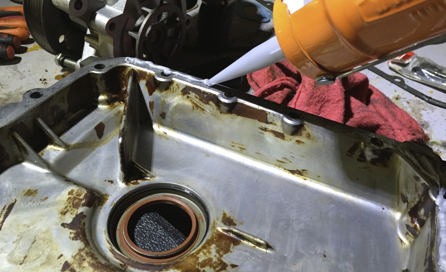 Applying Right Stuff to the timing cover's mating surface