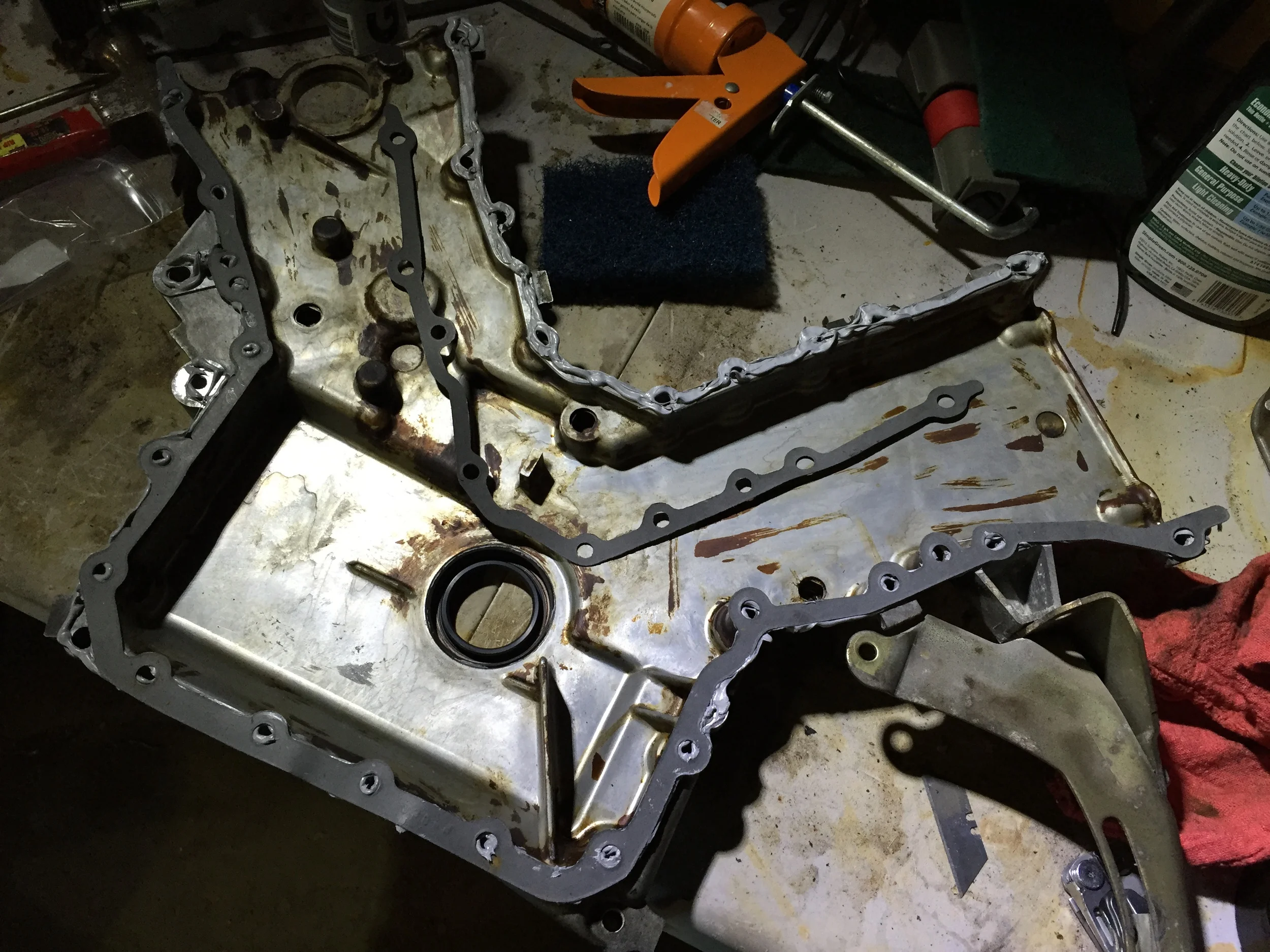 Liberal amounts of Right Stuff applied to install the upper timing cover gasket. The lower gasket is already mounted on the cover.