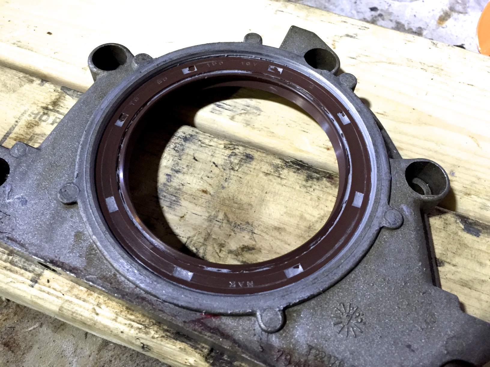 The new seal fully seated into the plate. It's a bit deeper in than the original seal, but that shouldn't matter.
