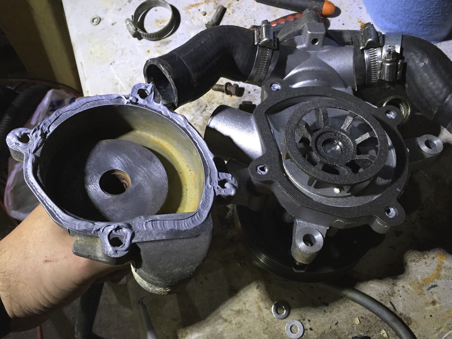 The gasket stuck to the back of the water pump with Right Stuff, and another coat of Right Stuff on the backing, ready to be mounted.