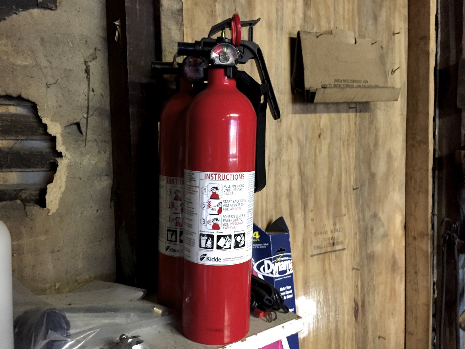 Two fire extinguishers. The one in the back is slightly discharged, so I got a second one to be sure I'm safe.