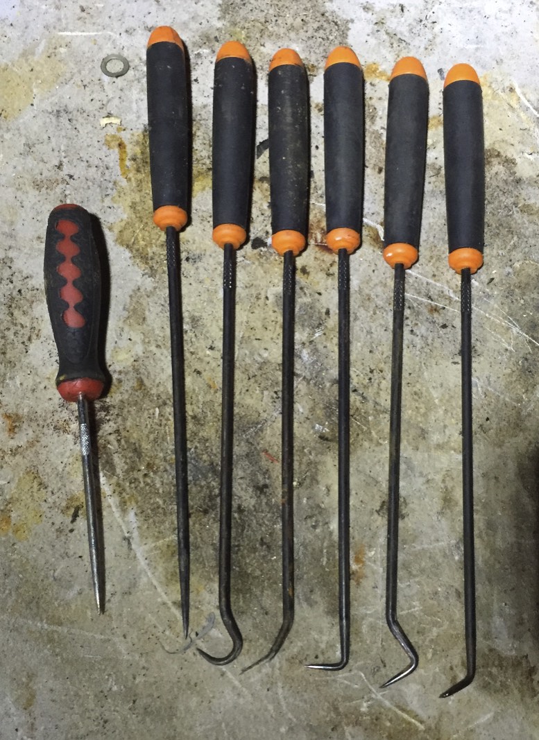 A short pick (left) and a series of long handle picks.