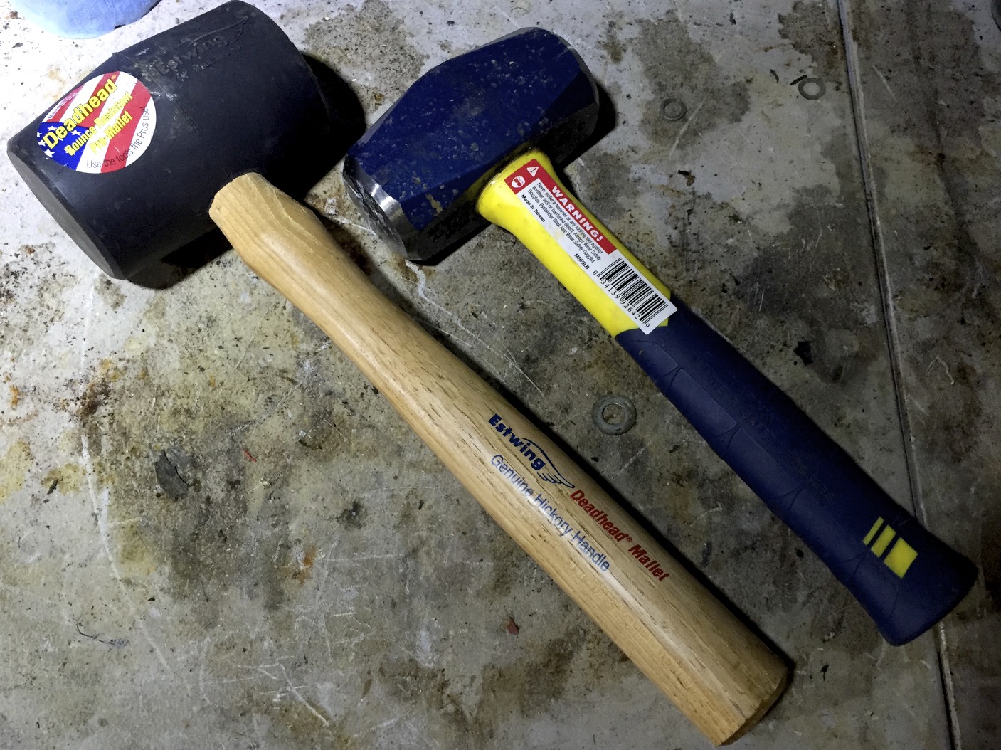 A rubber mallet (left) and a four pound hammer (right).