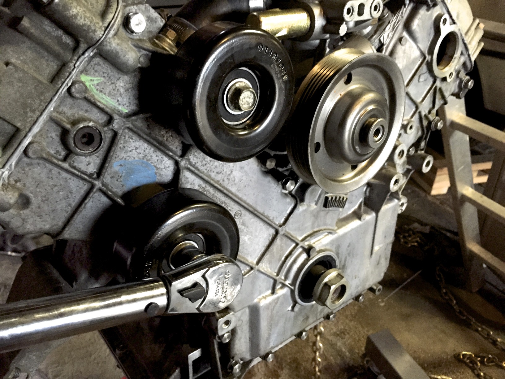 Torquing the lower idler pulley after installing the upper one.
