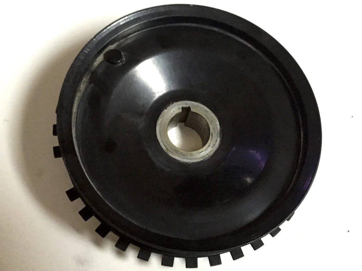 Front of the pulley with the missing tooth gear welded onto the pack. The missing tooth can be seen on the left side.