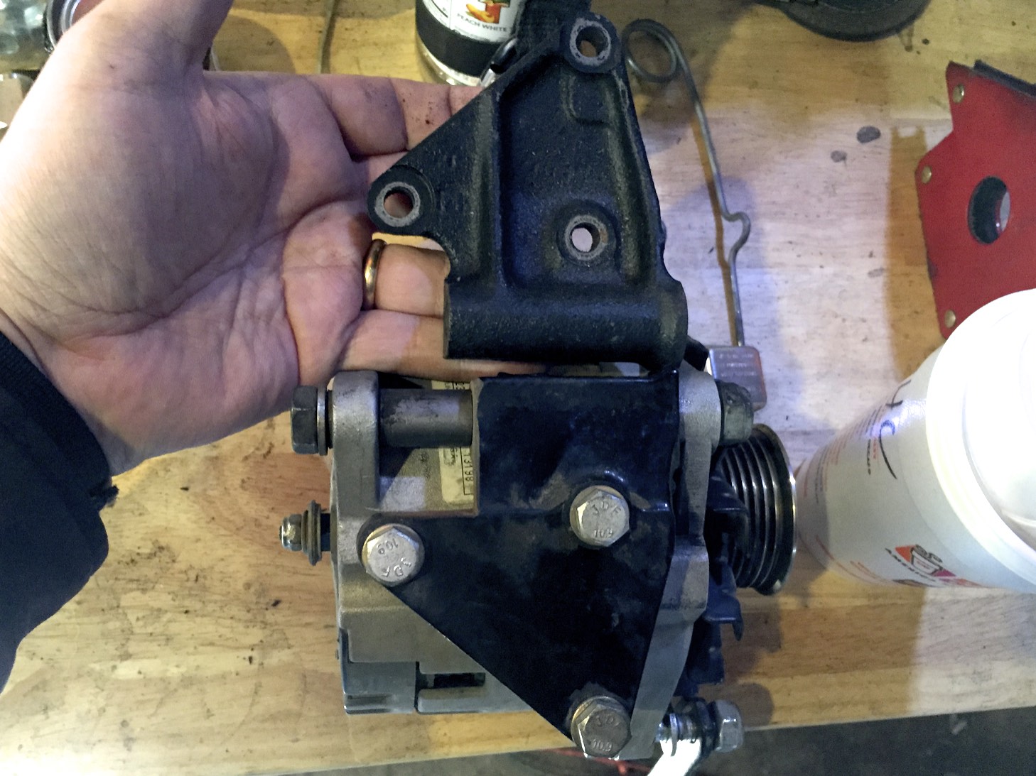 This more clearly shows the 9mm that were cut off of the modified bracket (bottom) versus the original bracket (top).