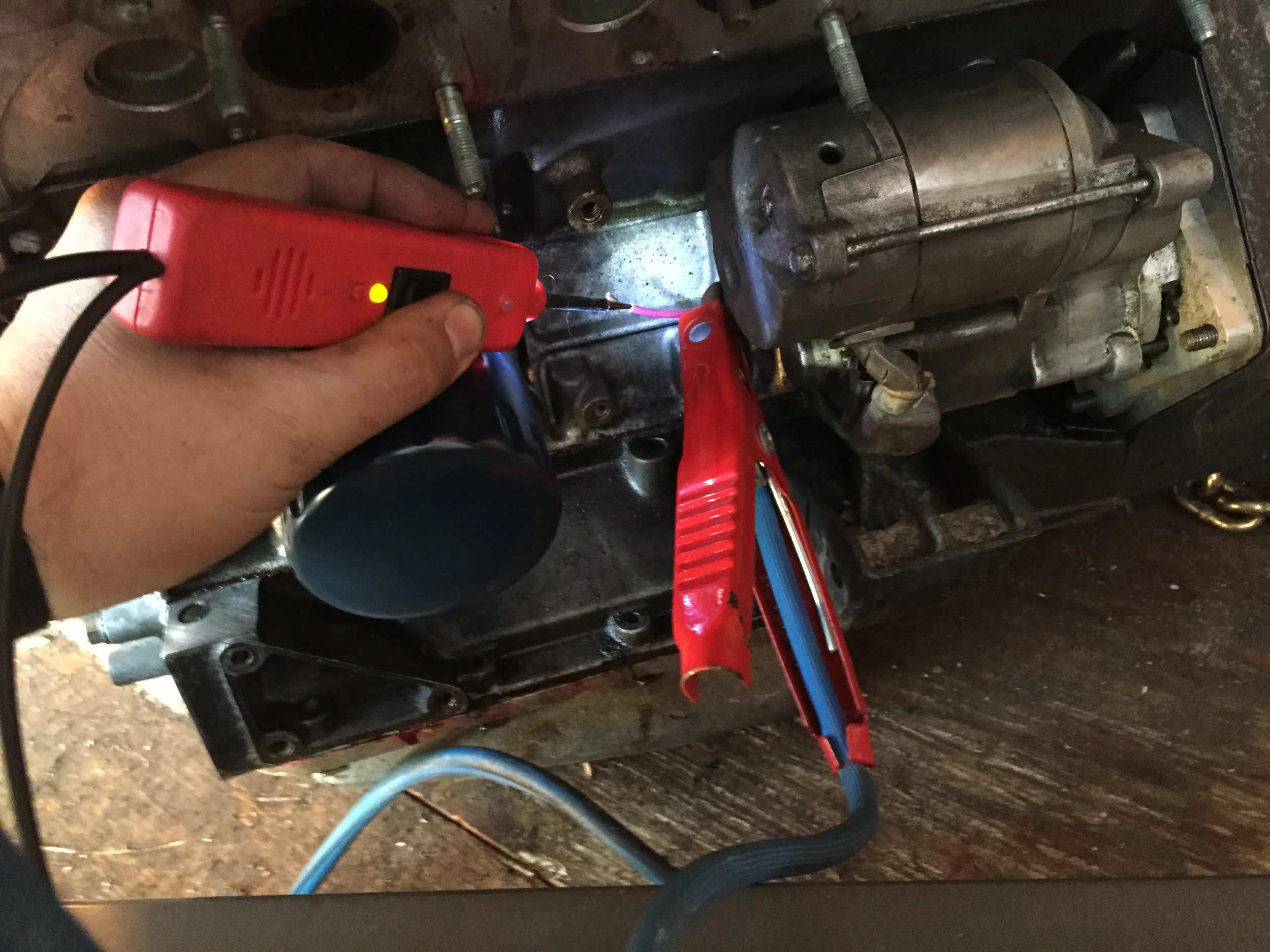 Getting ready to crank the engine with the Power Probe.