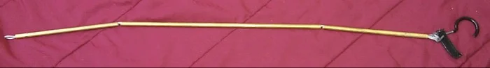 Fully straightened hanger, around 42 inches long to the end of the hook.