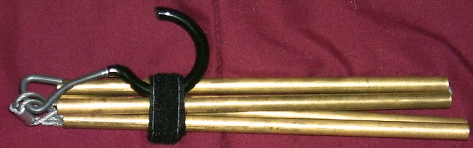 The new design collapsed. The total length is 7" shorter than the original, thus making it easier to store in my coat.