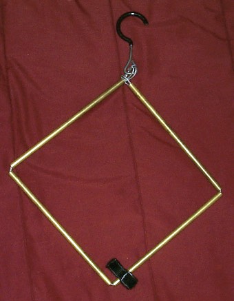When expanding, the hanger's crossbar needs to be assembled. This is done by simply sliding the tubes together. One of the pieces's outer tubes is shorter than the other sides, creating a simple and stronger than expected interlock.