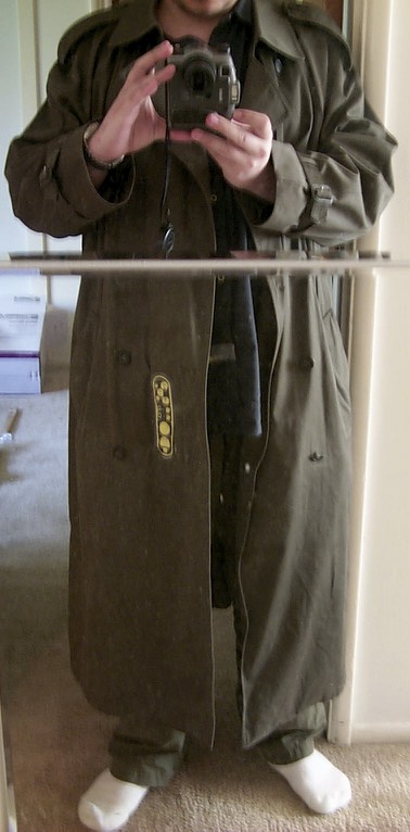The remote sits off to one side of the coat, in easy reach with the left hand.