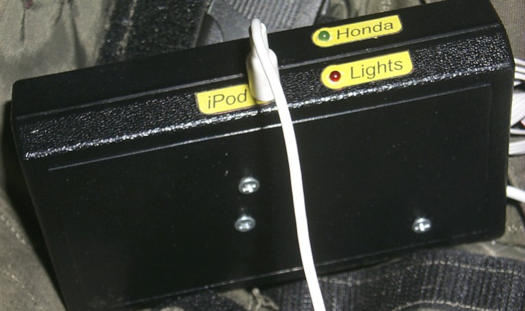There are separate diagnostic LEDs for the car alarm (green) and X-10 (red) remotes, and a jack for the iPod. The GDO doesn't have an LED on the board, and so doesn't have one on the case either.