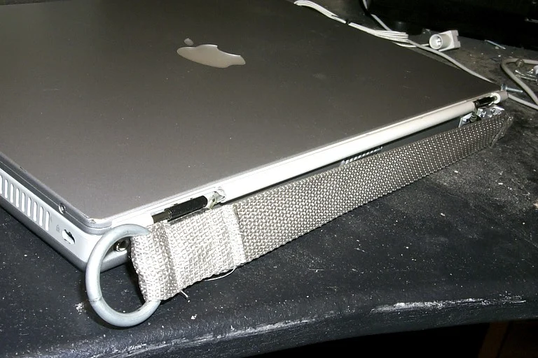 The new mount attached to the laptop, ports covered.
