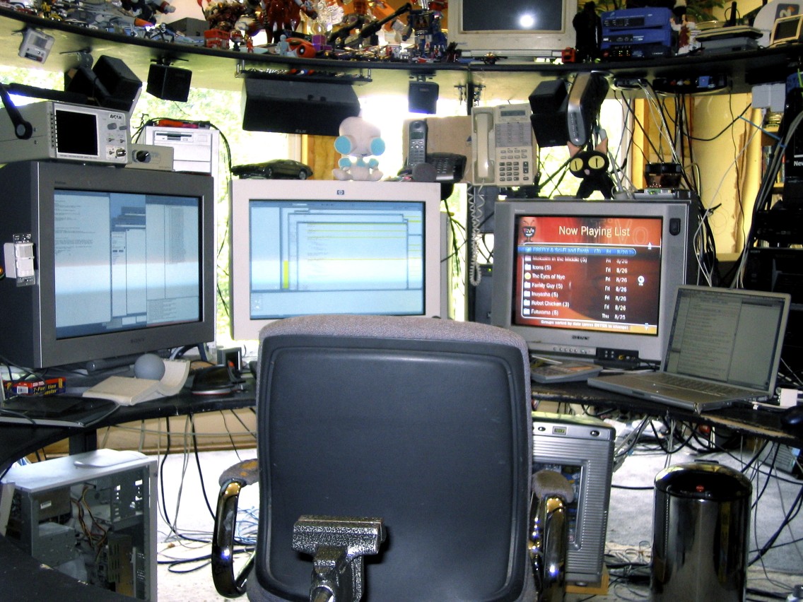 Two 24" Sony CRTs, a 20" Sony TV and a 15" Powerbook.