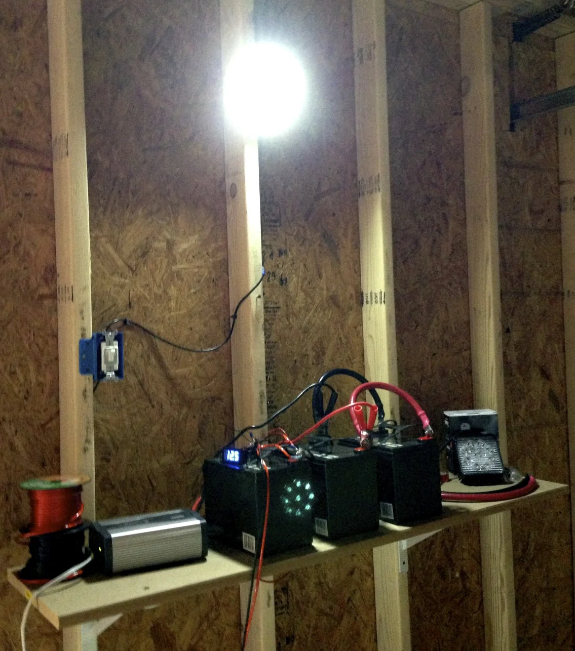 One of the work lights hooked up to the batteries.