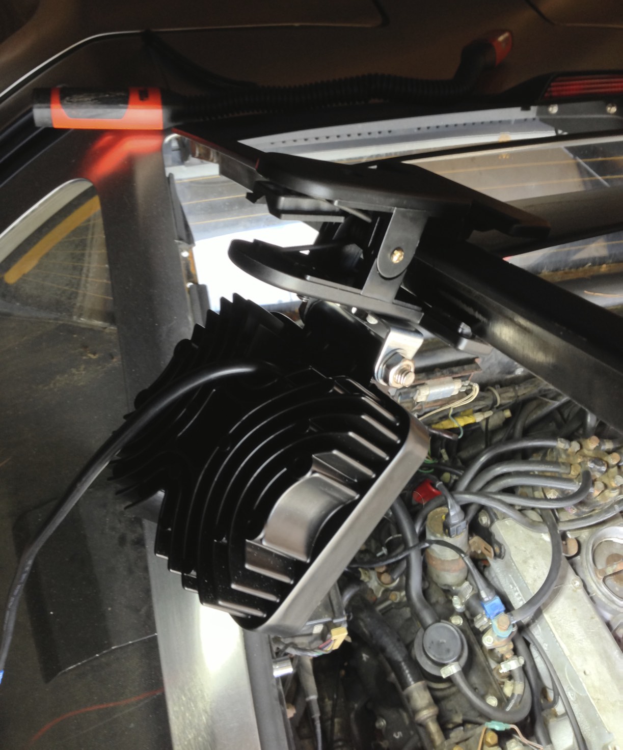 A light mounted on a clip so that it can be used easily in a variety of locations while working on the car.