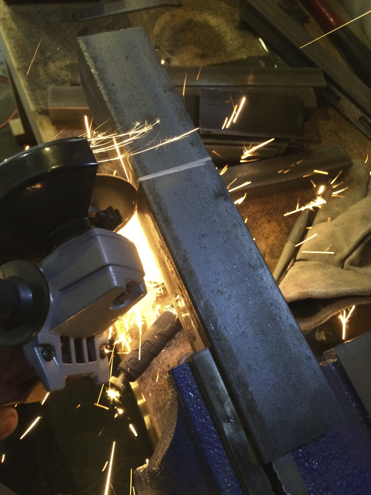 Cutting the square stock with an angle grinder and a cutting disc.